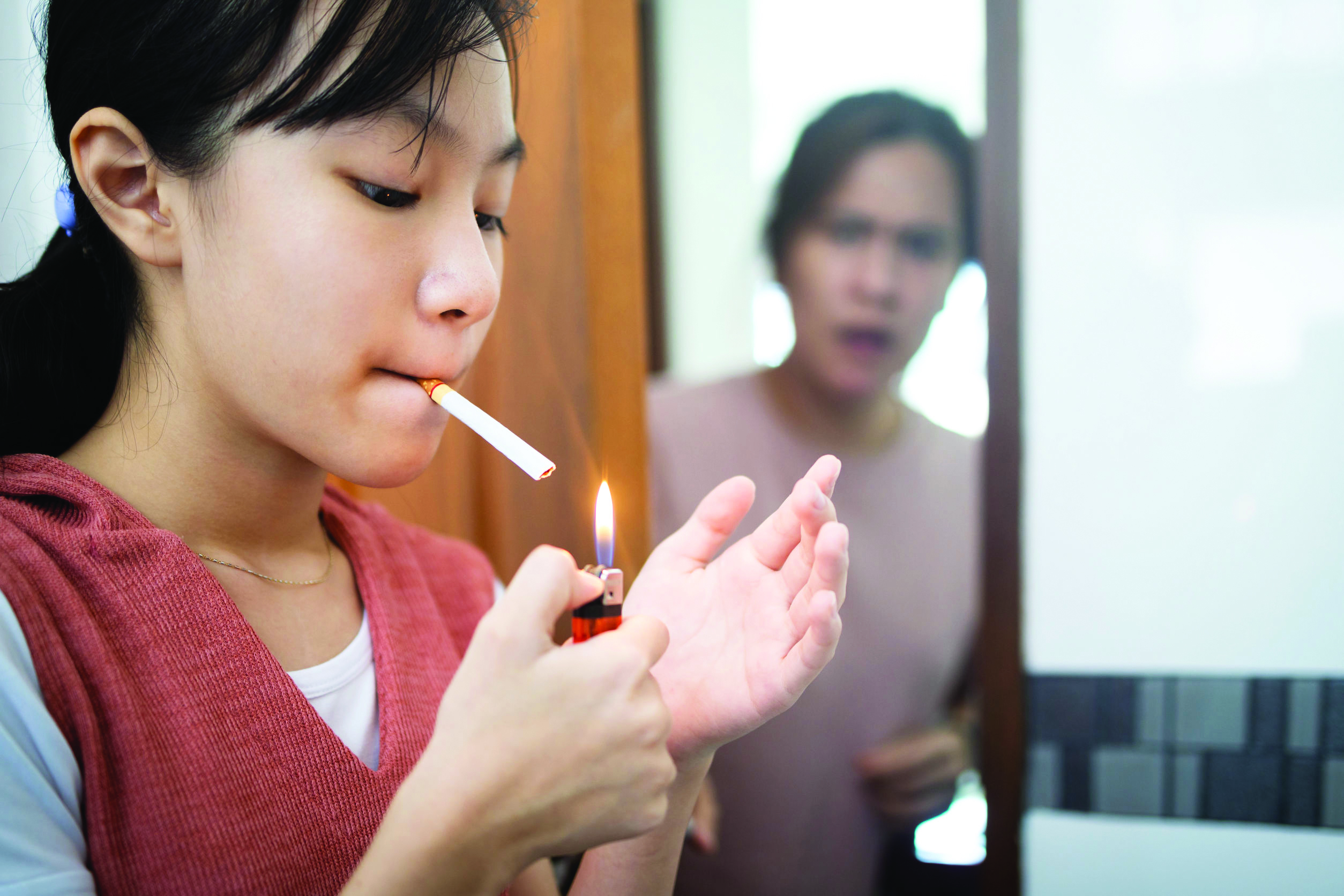 Child Girl Light Up The Cigarette At Homewoman Secretly Smoking